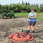 Danielle Bérard conducts a drone demonstration at EMILI’S Innovation Farms.